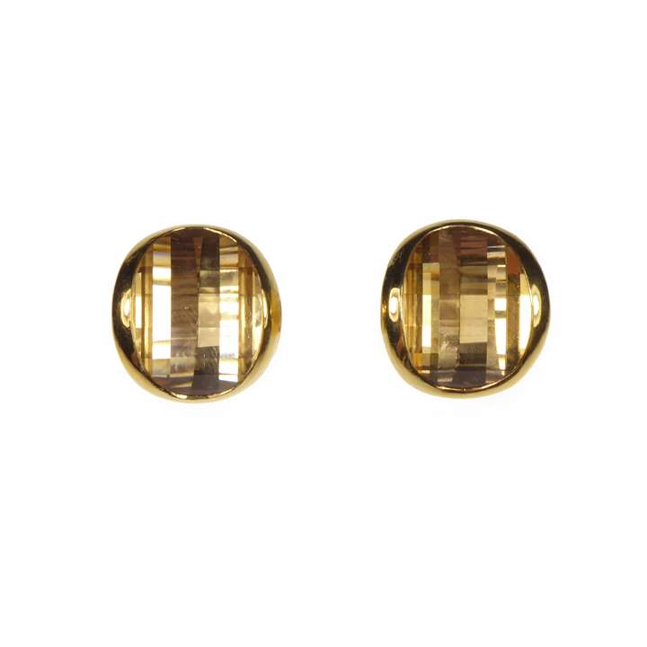 Citrine and gold earrings with oval fancy facetted citrines, possibly cut by Munsteiner, collet set